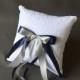 White lace wedding ring bearer pillow with navy and silver satin ribbon bows