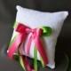 Lace wedding ring pillow with pink and green satin ribbon bows