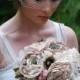Nude, Champagne, And Blush Fabric Bridal Bouquet With Layered Flowers And Brooches
