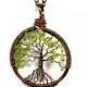The Spindly Roots Petite Tree of Life Antiqued Copper Necklace in Peridot.