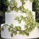 This Four-tiered White Wedding Cake Features Fondant Branches That Ascend To The Top Layer- Fabulous For A Wedding In Th...