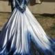 Blue And Black Metalic Wedding Gown With Matching Veil. Features Shimmering Metalic Fading Colors And Open Back Detail. Hanging Beads In Bac
