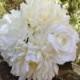 Bridesmaid bouquet in cream and white trimmed with burlap