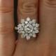 1960's Era 1.06ct Diamond Cluster Engagement Ring in Platinum, PGS Certified, 2.72 carat total weight, Floral Style Engagement Ring