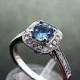AAAAA Stunning Very Rare Dark Blue Santa Maria Natural Aquamarine 5mm .50 Carats 14K white gold Diamond Halo engagement ring.