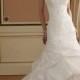 Curved Neck A-line Wedding Dress with Lace Bodice and Chapel Train Pick-up Skirt