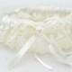 IVORY Lace Toss away Garter with stretchy elastic band. Add your own finishing touches of feathers, flowers and jewelry.