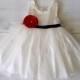 White Flower Girl Dress, Satin white dress with contracting navy ribbon sash and red satin flower.