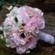 Bridal bouquet with light pink or white anemones, sweet pea, peonies and ranunculus