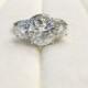 Francesca Charles and Colvard Forever Brilliant Moissanite 3 Stone Triple Halo Diamond Accent Ring
