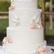 Ashley & Tanner's Ivory And Coral Wedding Cake