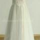 Flowy tulle lace wedding dress with illusion neckline and champgane lining