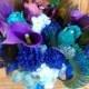 Purple blue bridal bouquet with teal, rhinestone, peacock feather accent