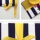 Navy Clutch in canopy stripe with yellow bow. The ALEXIS Clutch.