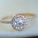 Rose gold diamond ring engagement ring with 1ct round white sapphire. Diamond halo rings