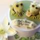 Frogs cake topper for a wedding cake with a lily pad wood base