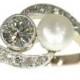 Fine antique two stone engagement ring set with 0.58ct diamond and pearl, 14k yellow gold