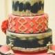 Red black and gold wedding cake