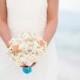 Turquoise malibu blue seashell wedding bouquet with starfish and shells on silk flower roses for beach wedding and destination weddings