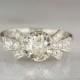 1.75ctw Edwardian / Art Deco Platinum Engagement Ring with 1.5ct Old European Cut Diamond Center; Single Cut Accents; Bow Motif PP234