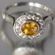 THE SECRET DELIGHT 14k gold Yellow Sapphire engagement ring with diamond halo