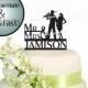 Silhouette Couple With Automatic Rifle Surname Wedding Cake Topper
