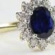 Sapphire and diamond cluster engagement ring in 9 carat gold