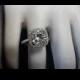 14kt White Gold Diamond Engagement Ring Center Is 8x8 Cushion Cut Forever Brlliant Moissanite G-SI2 Quality Diamonds Around The Halo