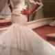 Stunning strapless tiered lace mermaid wedding dress