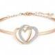 Swarovski Rose Gold-Tone Crystal Pavé Interlocking Double Heart Bangle Bracelet