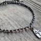 Crochet hematite bead necklace with silver plated cross pendant