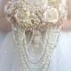 Silk flower brooch bouquet of rose gold, blush pink, champagne. Pink and gold jeweled crystal alternative cascading pearls bouquet