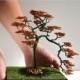 bonsai tree made of copper wires with amber and moss