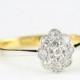Edwardian antique daisy oval ring with diamonds pave set in 18 carat gold and platinum antique