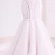 Strapless lace and blush organza trumpet wedding dress from Meera Meera