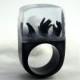 Zombie – creepy undead ring with three black hands and fog on a black ring made of resin