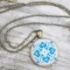 Blue Quatrefoil embroidered pendant on vintage fabric. Cross stitch pendant necklace. Textile jewelry. Ethnic symbol. Gift for her