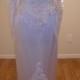 White Satin Sheath Gown  Full detachable train Long sleeve, heavily beaded with Pearls and sequins,