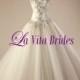Silver lace drop waist wedding gown with tulle ball gown skirt and pleated bodice
