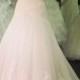 Beautiful strapless trumpet tulle with lace detailed wedding dress