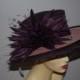 A double brimmed feature hat with large feather detail-- Style name Berry Made to Order