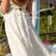 ivory lace cap sleeve with low plunging v back ball gown