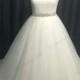 Plus size tulle ball gown wedding dress with beading details
