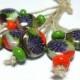 Lampwork  Glass bead handmade  Beads red orange green bright green purple flowers.