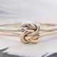 14k gold double love knot ring, perfect as an alternative engagement or promise ring