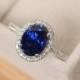 Halo engagement ring, sapphire ring, oval cut, blue gemstone, sterling silver
