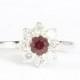 Antique ruby and diamond daisy ring in 18 carat white gold vintage