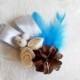 Winter wedding frozen wonderland boutonniere/corsage Cream Flowers, pine cones, feathers, frozen fruits, sola roses, blue