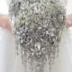 BROOCH BOUQUET in teardrop cascading waterfall bridal style. Jeweled with silver crystals and brooches