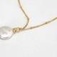 Dangling Karats Freshwater coin pearl  necklace in silver with delicate chain. Single pearl necklace with a satellite chain chain necklace